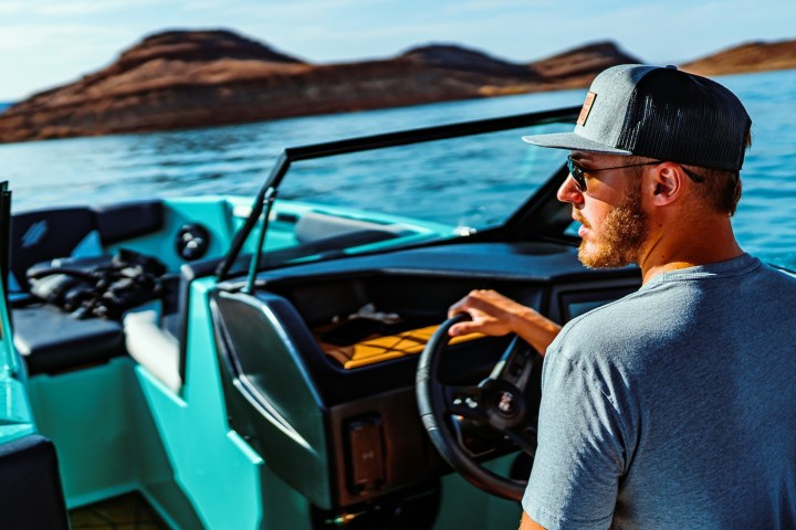 a man sitting on a boat in the water