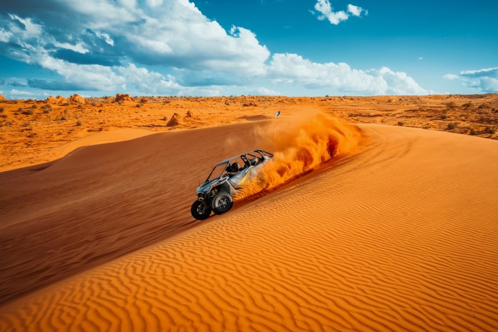 a motorcycle parked on the sand