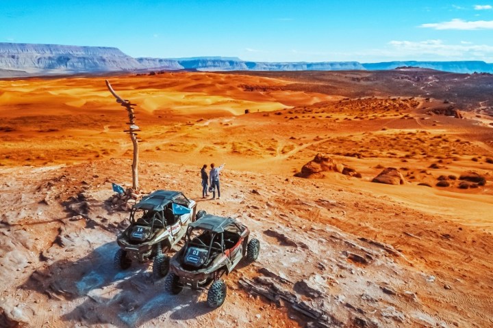 a beach with a mountain in the desert
